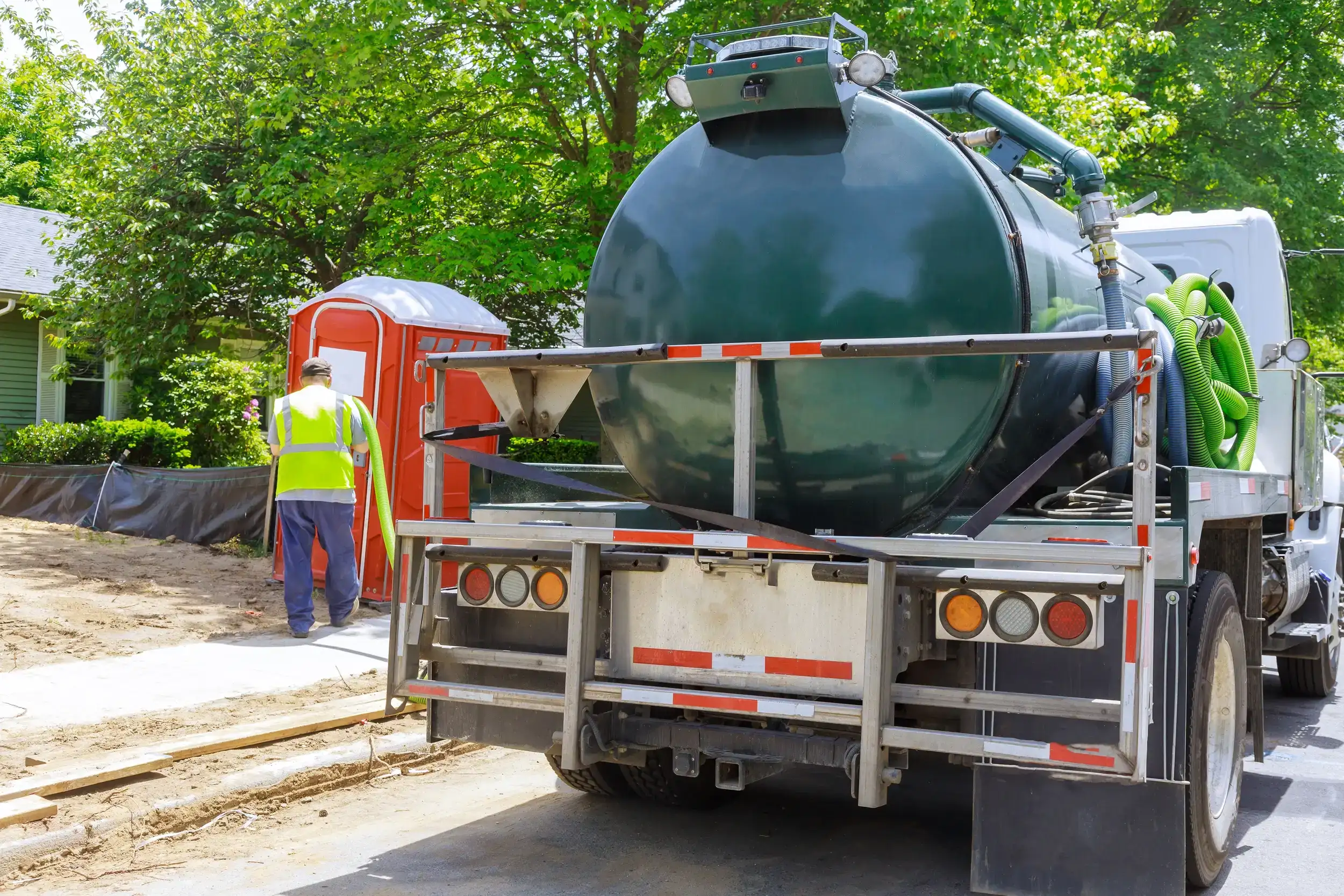 A Sewage truck ready to pump the septic of the portable toilet.